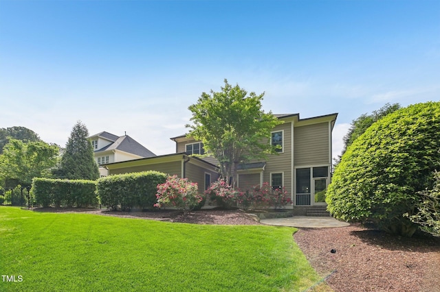 528 Bankhead Dr, Cary, NC 27519 - rear view of property featuring a lawn