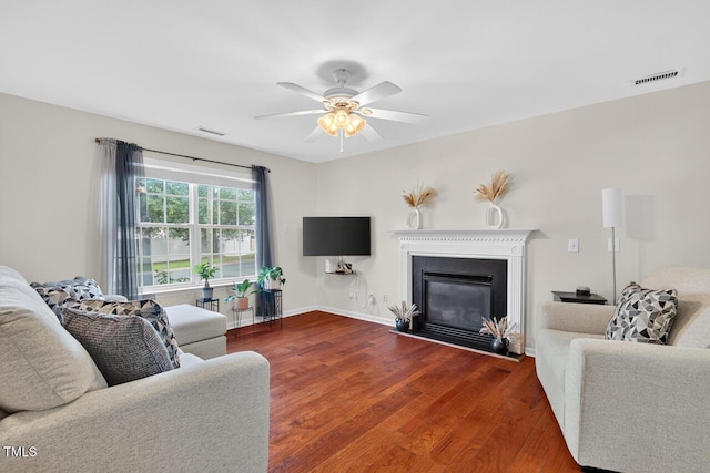 5 Ocean Ct, Durham, NC 27704 - living area featuring wood finished floors, a ceiling fan, and a glass covered fireplace