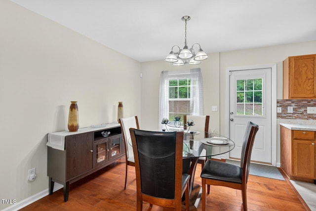 5 Ocean Ct, Durham, NC 27704 - dining area featuring a chandelier and light wood-style flooring