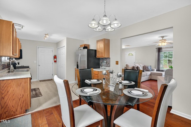 5 Ocean Ct, Durham, NC 27704 - dining space featuring a chandelier, light wood-style flooring, and ceiling fan