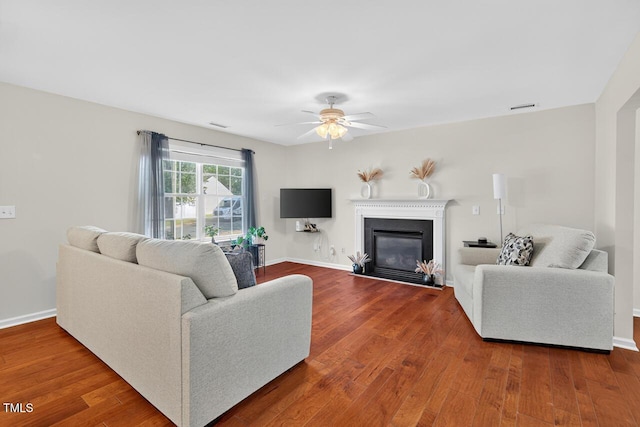 5 Ocean Ct, Durham, NC 27704 - living area featuring ceiling fan, wood finished floors, and a fireplace with flush hearth