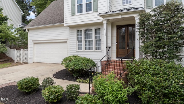 7908 Mayapple Pl, Raleigh, NC 27613 - property entrance featuring roof with shingles and driveway