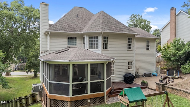7908 Mayapple Pl, Raleigh, NC 27613 - rear view of house with a shingled roof, a chimney, a sunroom, and a deck