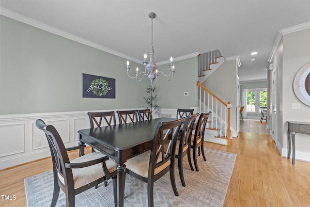 7908 Mayapple Pl, Raleigh, NC 27613 - dining area with ornamental molding, stairs, light wood-style floors, a chandelier, and recessed lighting