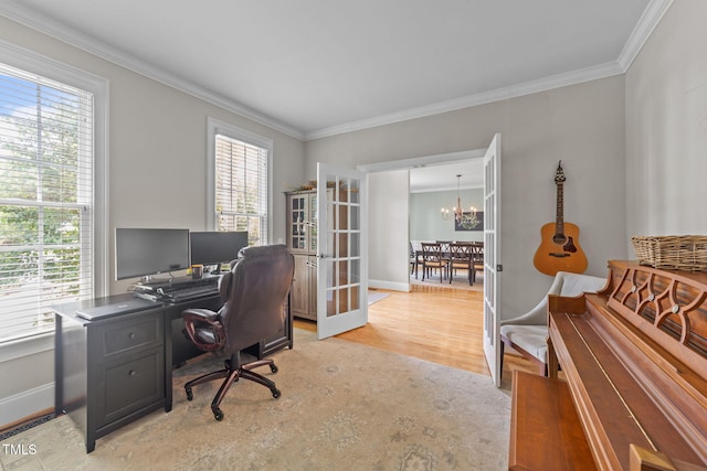 7908 Mayapple Pl, Raleigh, NC 27613 - home office with a chandelier, healthy amount of natural light, ornamental molding, and light wood finished floors
