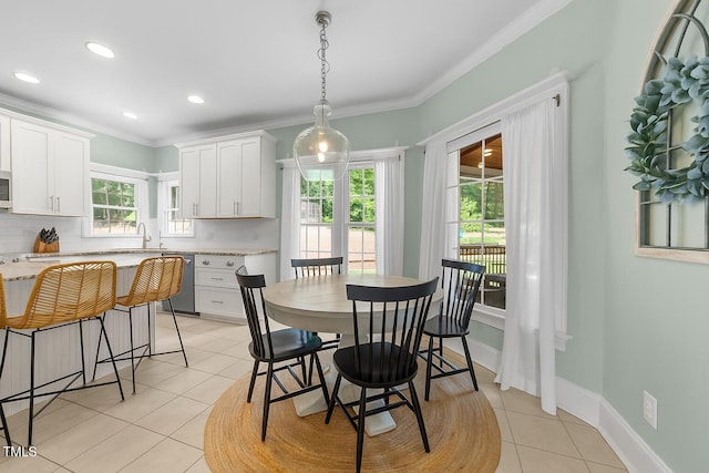 7908 Mayapple Pl, Raleigh, NC 27613 - dining area featuring light tile patterned floors, plenty of natural light, ornamental molding, and recessed lighting