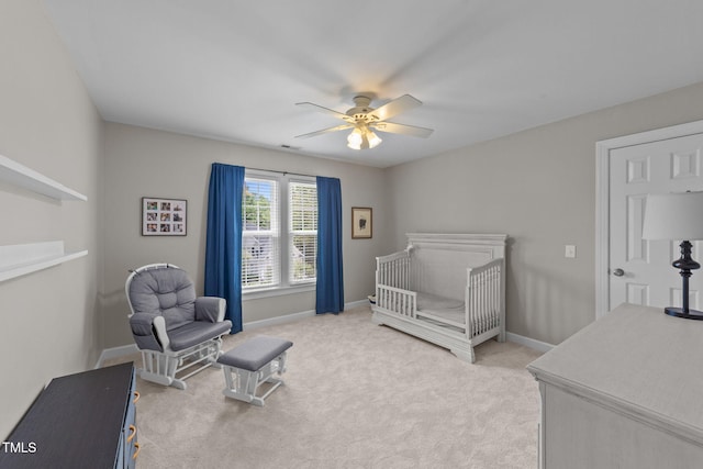 7908 Mayapple Pl, Raleigh, NC 27613 - bedroom featuring light carpet, a nursery area, and ceiling fan