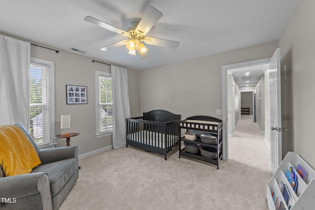 7908 Mayapple Pl, Raleigh, NC 27613 - bedroom featuring carpet flooring, a ceiling fan, and a crib