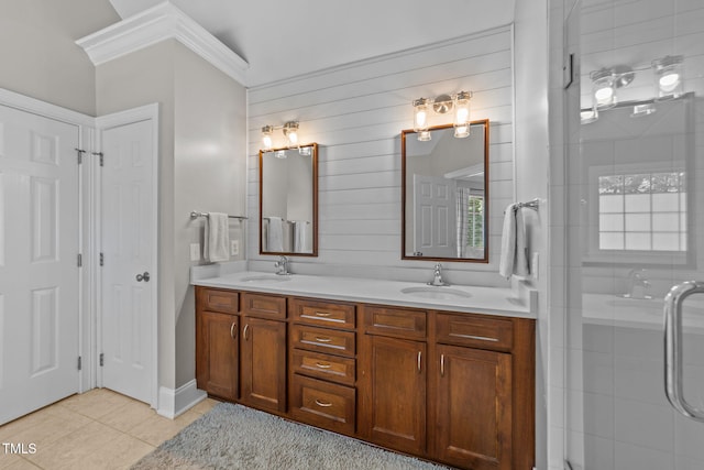 7908 Mayapple Pl, Raleigh, NC 27613 - bathroom with double vanity, crown molding, tile patterned floors, and a shower stall