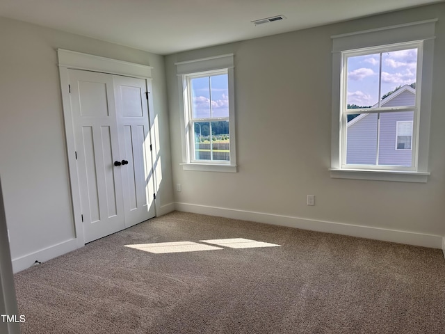 163 Noramac Ct, Selma, NC 27576 - unfurnished bedroom with carpet flooring and a closet