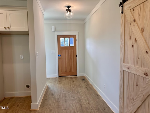 163 Noramac Ct, Selma, NC 27576 - entrance foyer featuring light wood-style floors and crown molding