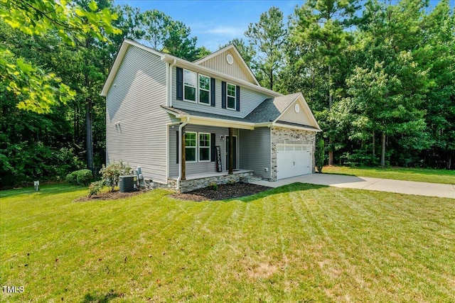 205 Willow Ridge Dr, Louisburg, NC 27549 - view of front of house with an attached garage, a front yard, driveway, and stone siding
