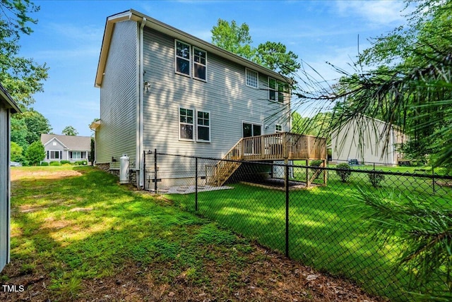 205 Willow Ridge Dr, Louisburg, NC 27549 - rear view of house with a deck and stairway
