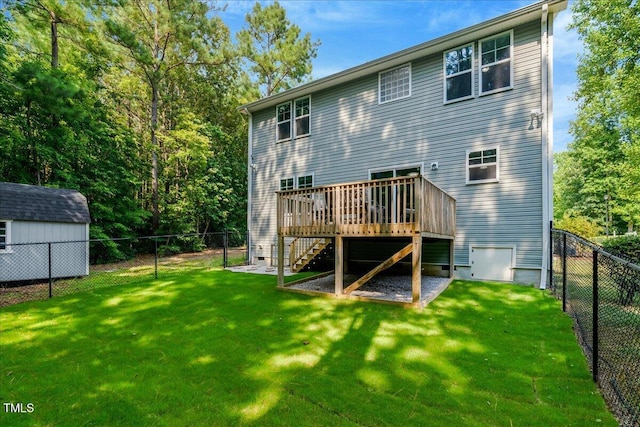 205 Willow Ridge Dr, Louisburg, NC 27549 - back of property featuring a fenced backyard, stairs, a wooden deck, and a storage unit