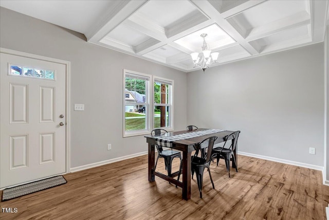 205 Willow Ridge Dr, Louisburg, NC 27549 - dining area featuring a chandelier, beamed ceiling, light wood-type flooring, and coffered ceiling