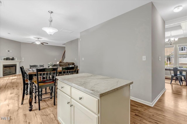 205 Willow Ridge Dr, Louisburg, NC 27549 - kitchen featuring light wood finished floors, open floor plan, and a ceiling fan