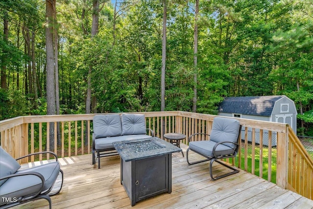 205 Willow Ridge Dr, Louisburg, NC 27549 - wooden deck featuring a fire pit and a storage shed