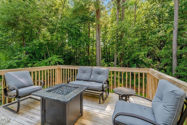 205 Willow Ridge Dr, Louisburg, NC 27549 - wooden terrace featuring a fire pit