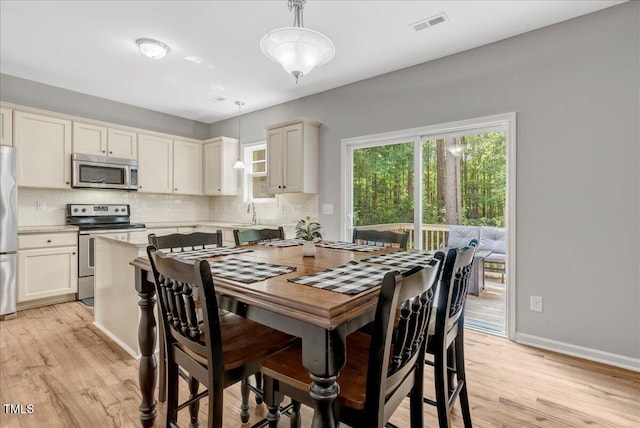 205 Willow Ridge Dr, Louisburg, NC 27549 - dining space featuring light wood-style floors