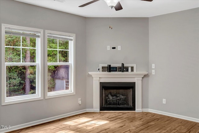 205 Willow Ridge Dr, Louisburg, NC 27549 - unfurnished living room with ceiling fan, wood finished floors, and a fireplace