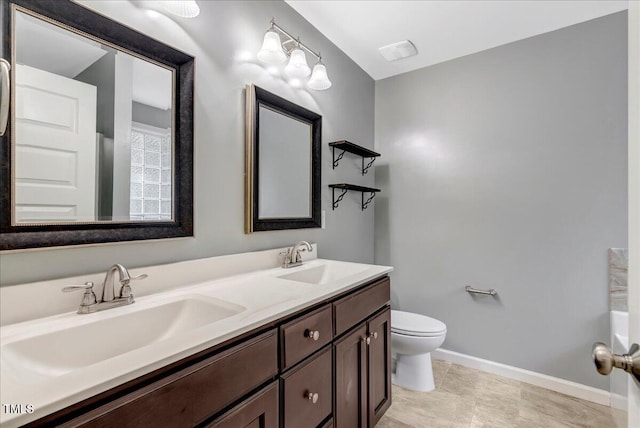 205 Willow Ridge Dr, Louisburg, NC 27549 - bathroom featuring double vanity and toilet