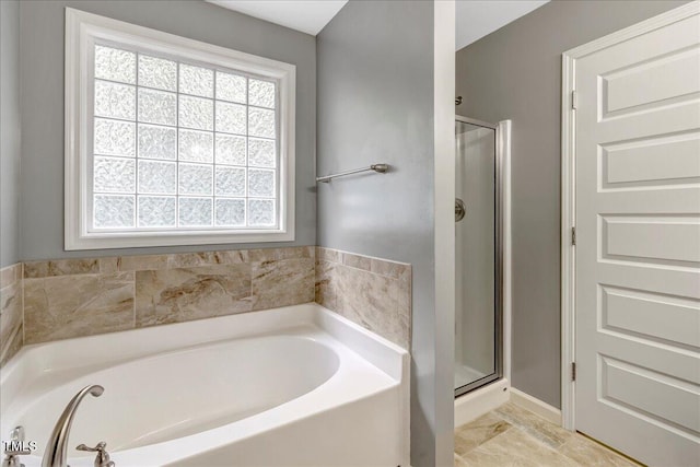 205 Willow Ridge Dr, Louisburg, NC 27549 - bathroom with a bath and a shower stall