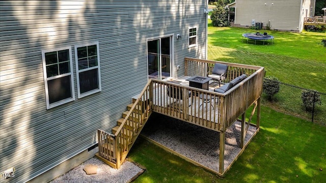 205 Willow Ridge Dr, Louisburg, NC 27549 - wooden deck featuring a trampoline and a fire pit