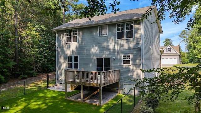 205 Willow Ridge Dr, Louisburg, NC 27549 - rear view of house with a wooden deck and a garage