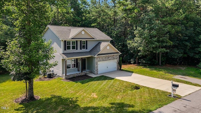 205 Willow Ridge Dr, Louisburg, NC 27549 - view of front of home with concrete driveway, covered porch, a front yard, and a garage