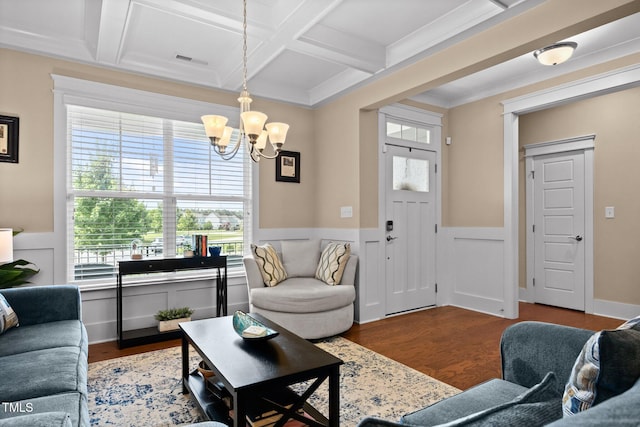 8713 Halsey Ln, Wake Forest, NC 27587 - living room with coffered ceiling, wood finished floors, a chandelier, a wainscoted wall, and beamed ceiling