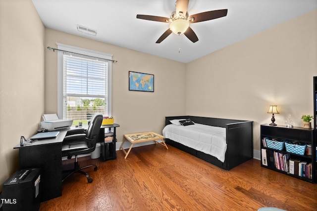 8713 Halsey Ln, Wake Forest, NC 27587 - bedroom featuring wood finished floors, a ceiling fan, and an office area