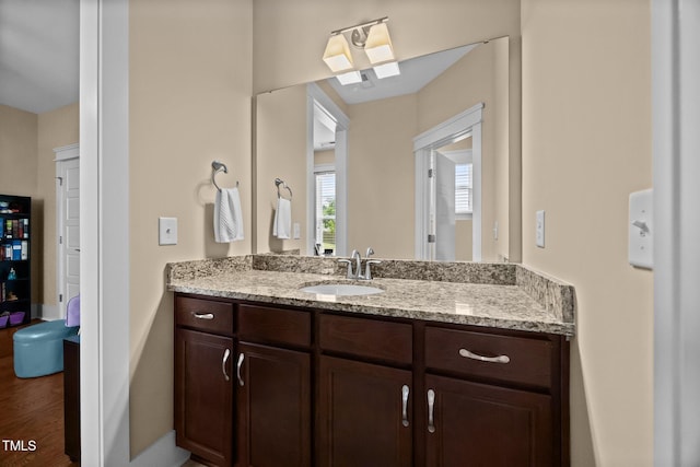 8713 Halsey Ln, Wake Forest, NC 27587 - bathroom with vanity, wood finished floors, and a skylight