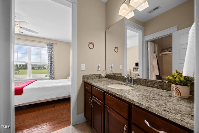 8713 Halsey Ln, Wake Forest, NC 27587 - ensuite bathroom featuring vanity, ceiling fan, and tile patterned flooring