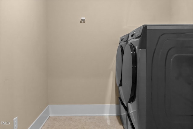 8713 Halsey Ln, Wake Forest, NC 27587 - laundry room with washer and dryer and tile patterned flooring