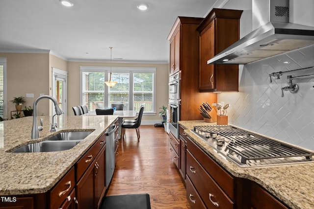 8713 Halsey Ln, Wake Forest, NC 27587 - kitchen featuring wall chimney exhaust hood, appliances with stainless steel finishes, dark wood-style flooring, crown molding, and decorative backsplash