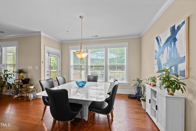 8713 Halsey Ln, Wake Forest, NC 27587 - dining room with healthy amount of natural light, crown molding, and wood finished floors