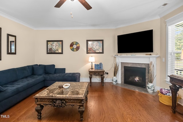 8713 Halsey Ln, Wake Forest, NC 27587 - living area with wood finished floors, a ceiling fan, ornamental molding, and a fireplace with flush hearth