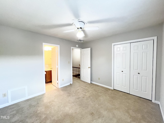 2206 Alpine Rd, Durham, NC 27707 - unfurnished bedroom featuring carpet, a closet, connected bathroom, and a ceiling fan