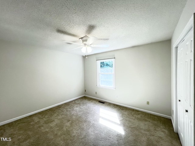 2206 Alpine Rd, Durham, NC 27707 - unfurnished bedroom with carpet, a closet, a textured ceiling, and a ceiling fan