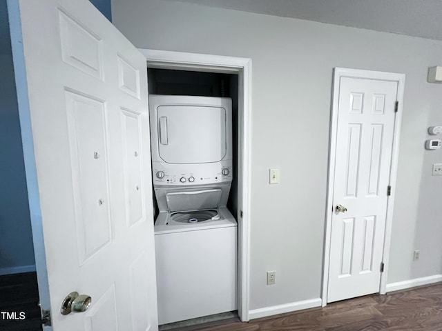 2206 Alpine Rd, Durham, NC 27707 - laundry room featuring stacked washer / drying machine and wood finished floors