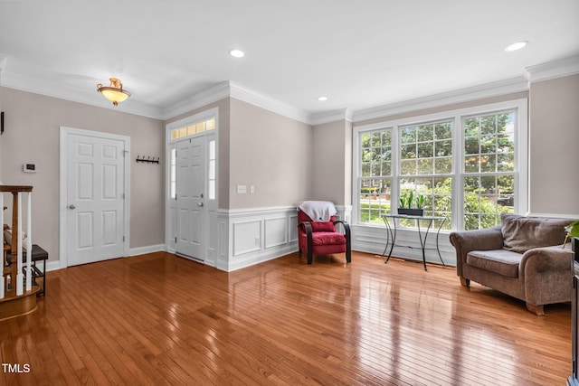 2506 Happy Ln, Raleigh, NC 27614 - sitting room with light wood-style floors, a wainscoted wall, recessed lighting, and crown molding