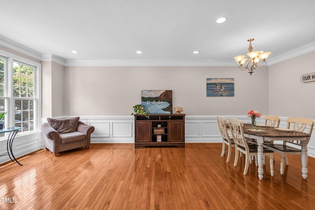2506 Happy Ln, Raleigh, NC 27614 - dining space featuring a chandelier, ornamental molding, light wood-type flooring, recessed lighting, and a wainscoted wall