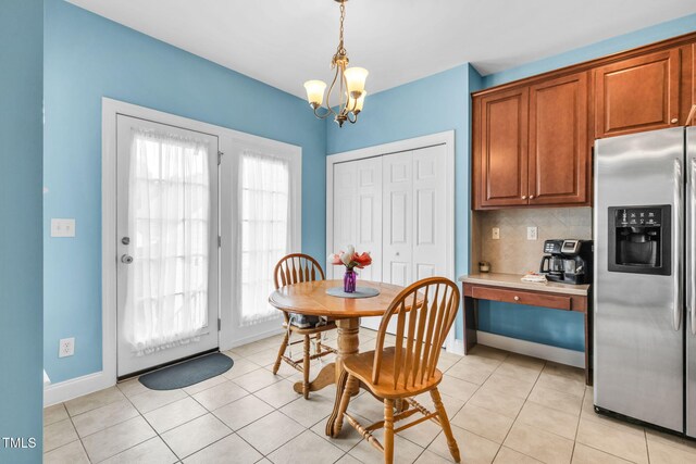 2506 Happy Ln, Raleigh, NC 27614 - dining room featuring a chandelier and light tile patterned floors