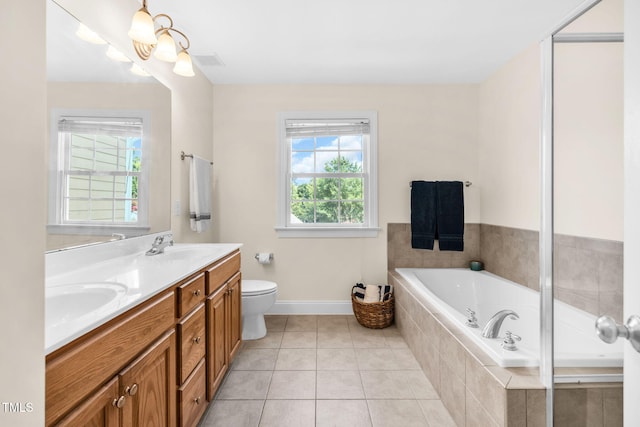 2506 Happy Ln, Raleigh, NC 27614 - bathroom featuring double vanity, a garden tub, plenty of natural light, and tile patterned floors