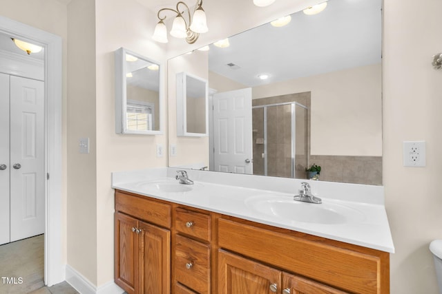 2506 Happy Ln, Raleigh, NC 27614 - bathroom featuring double vanity, a stall shower, and a chandelier
