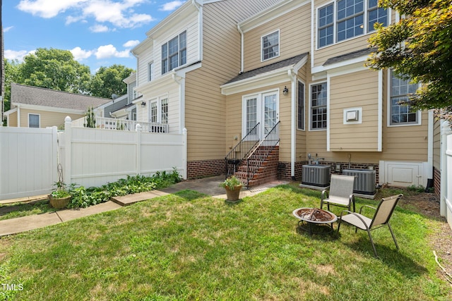 2506 Happy Ln, Raleigh, NC 27614 - rear view of property featuring entry steps and a fire pit