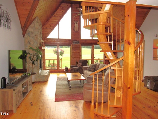 1159 Flemingtown Rd, Henderson, NC 27537 - living area with stairway, hardwood / wood-style flooring, high vaulted ceiling, and a wooden ceiling with exposed beams