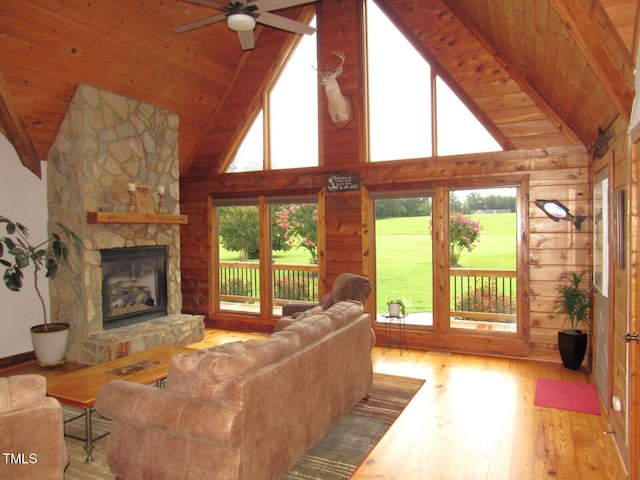 1159 Flemingtown Rd, Henderson, NC 27537 - living area with a wooden ceiling with exposed beams, wood-type flooring, high vaulted ceiling, a ceiling fan, and a fireplace