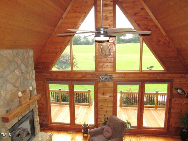 1159 Flemingtown Rd, Henderson, NC 27537 - living room with wood finished floors, high vaulted ceiling, wooden ceiling, healthy amount of natural light, and wooden walls