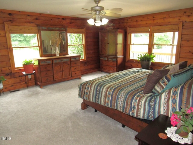 1159 Flemingtown Rd, Henderson, NC 27537 - bedroom featuring wooden walls and light carpet